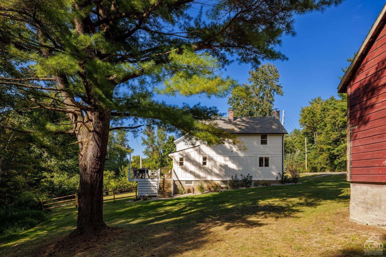 613 Fischer Road Kinderhook, NY 12106 - Photo 18 of 21 a view of a house with a yard