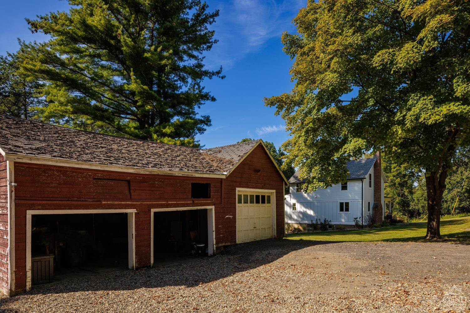 613 Fischer Road Kinderhook, NY 12106 - Photo 19 of 21 a front view of a house with a yard and a garage