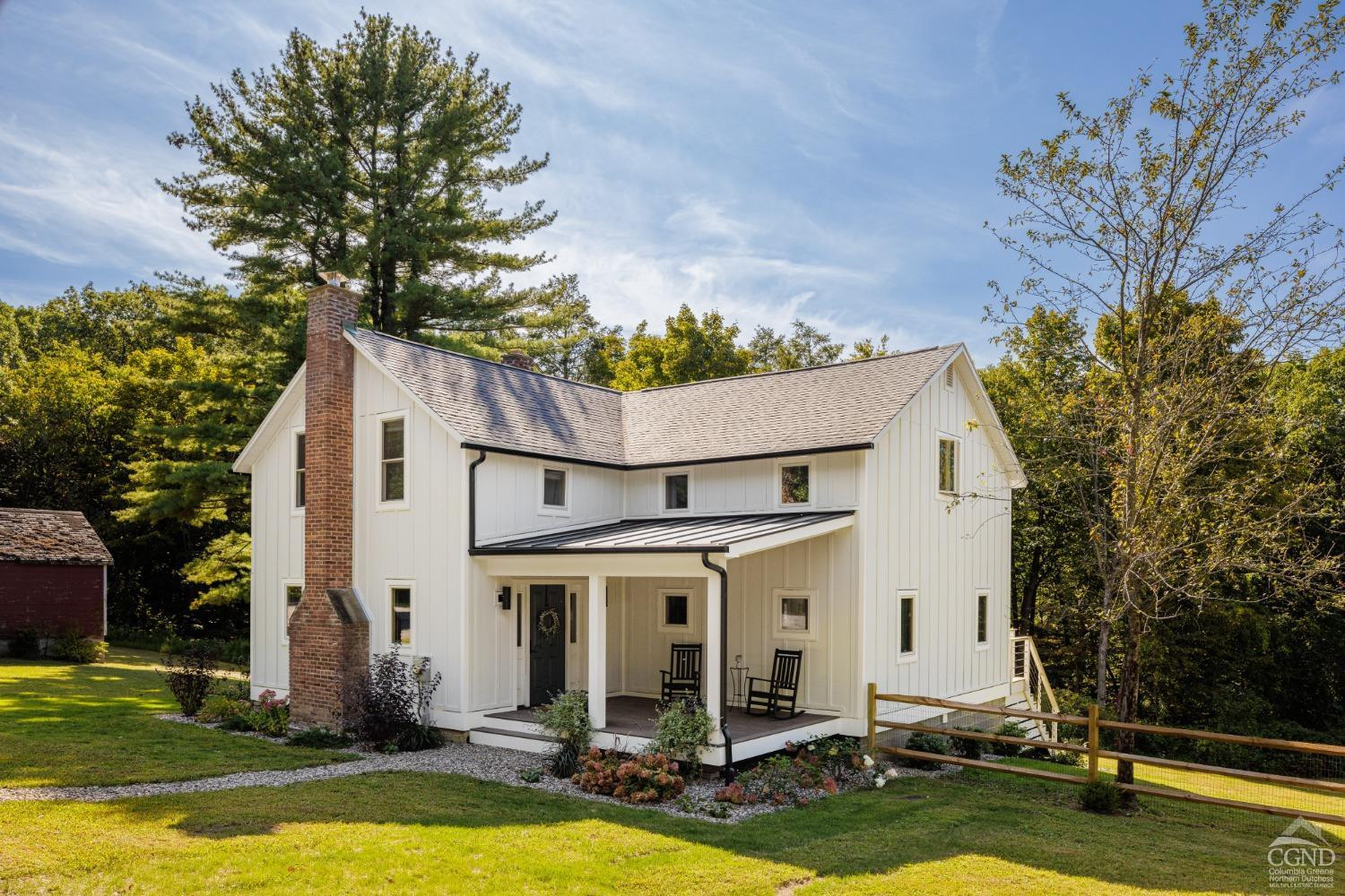 613 Fischer Road Kinderhook, NY 12106 - Photo 3 of 21 a view of a white house with a swimming pool and a fountain