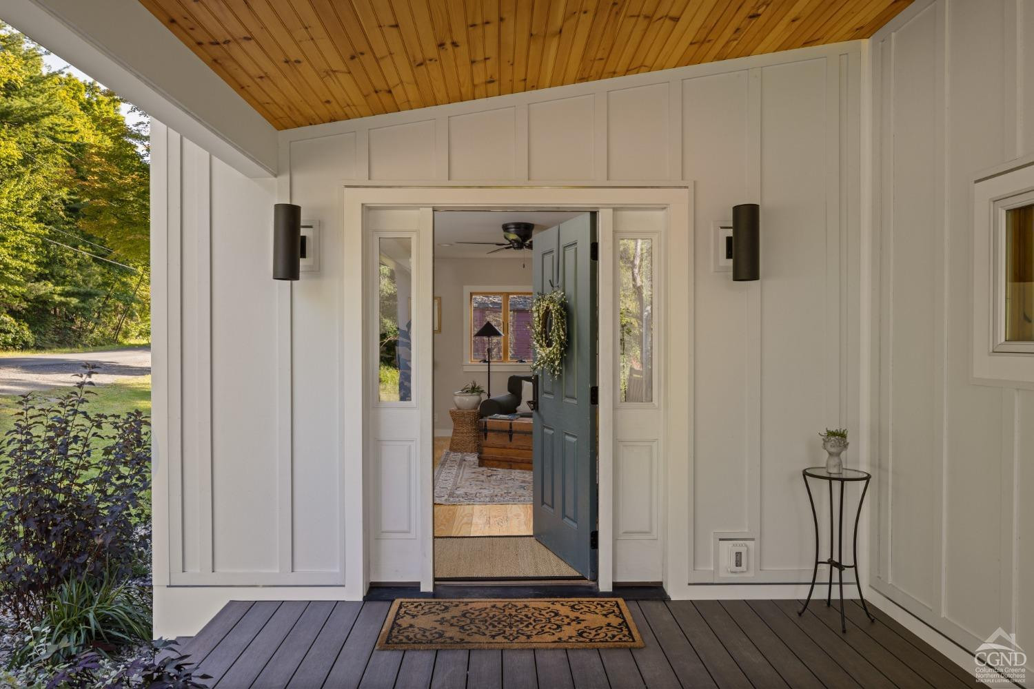613 Fischer Road Kinderhook, NY 12106 - Photo 4 of 21 a view of a porch with wooden floor and front door