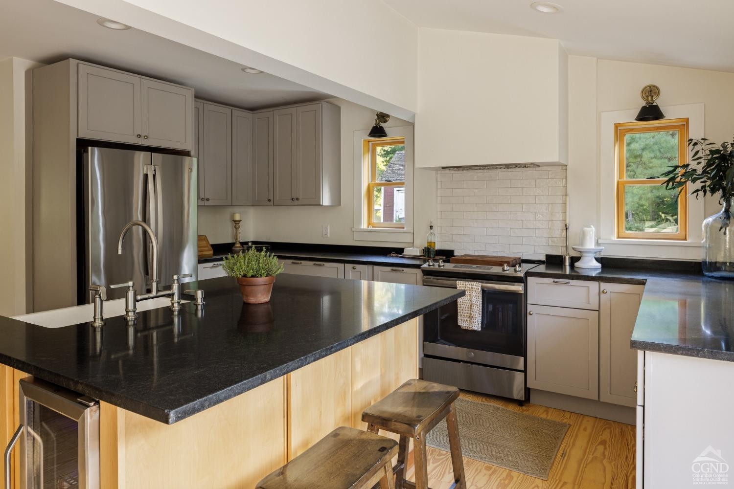 613 Fischer Road Kinderhook, NY 12106 - Photo 8 of 21 a kitchen with a counter top a sink a window and stainless steel appliances