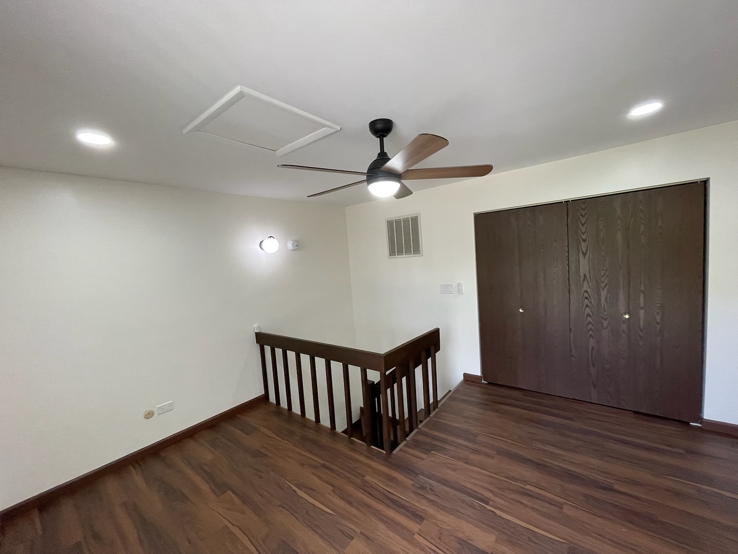 149 Forest Avenue, Unit D Fox Lake, IL 60020 - Photo 15 of 44 a view of a hallway with wooden floor and stairs