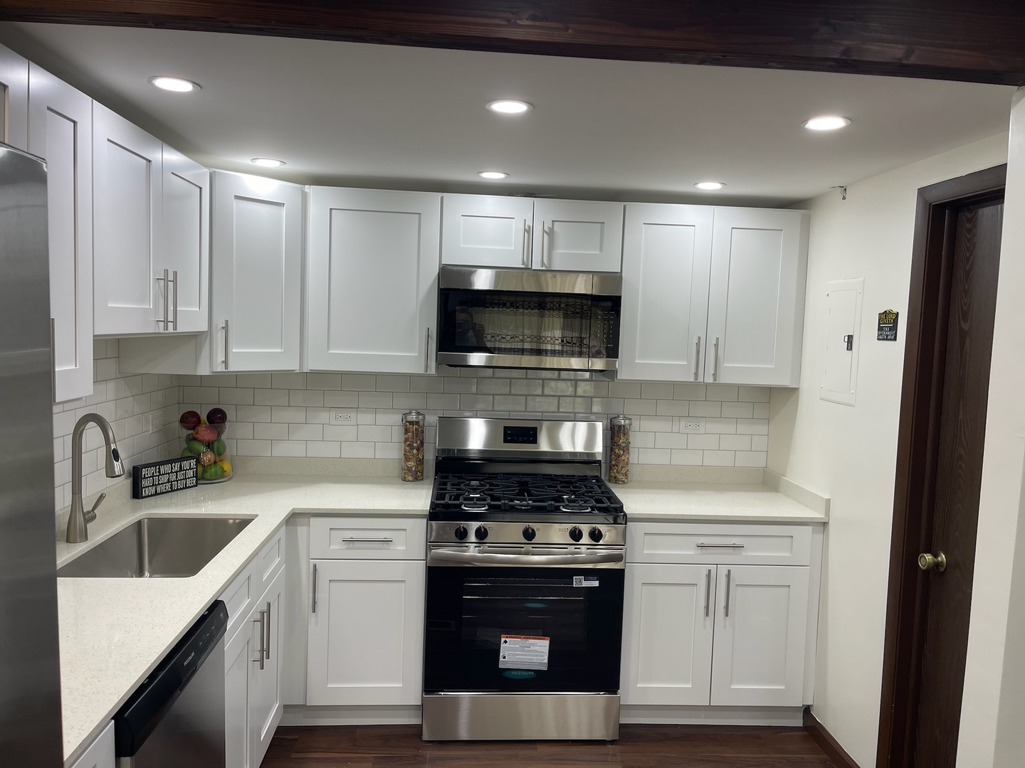 149 Forest Avenue, Unit D Fox Lake, IL 60020 - Photo 28 of 44 a kitchen with sink a microwave and cabinets