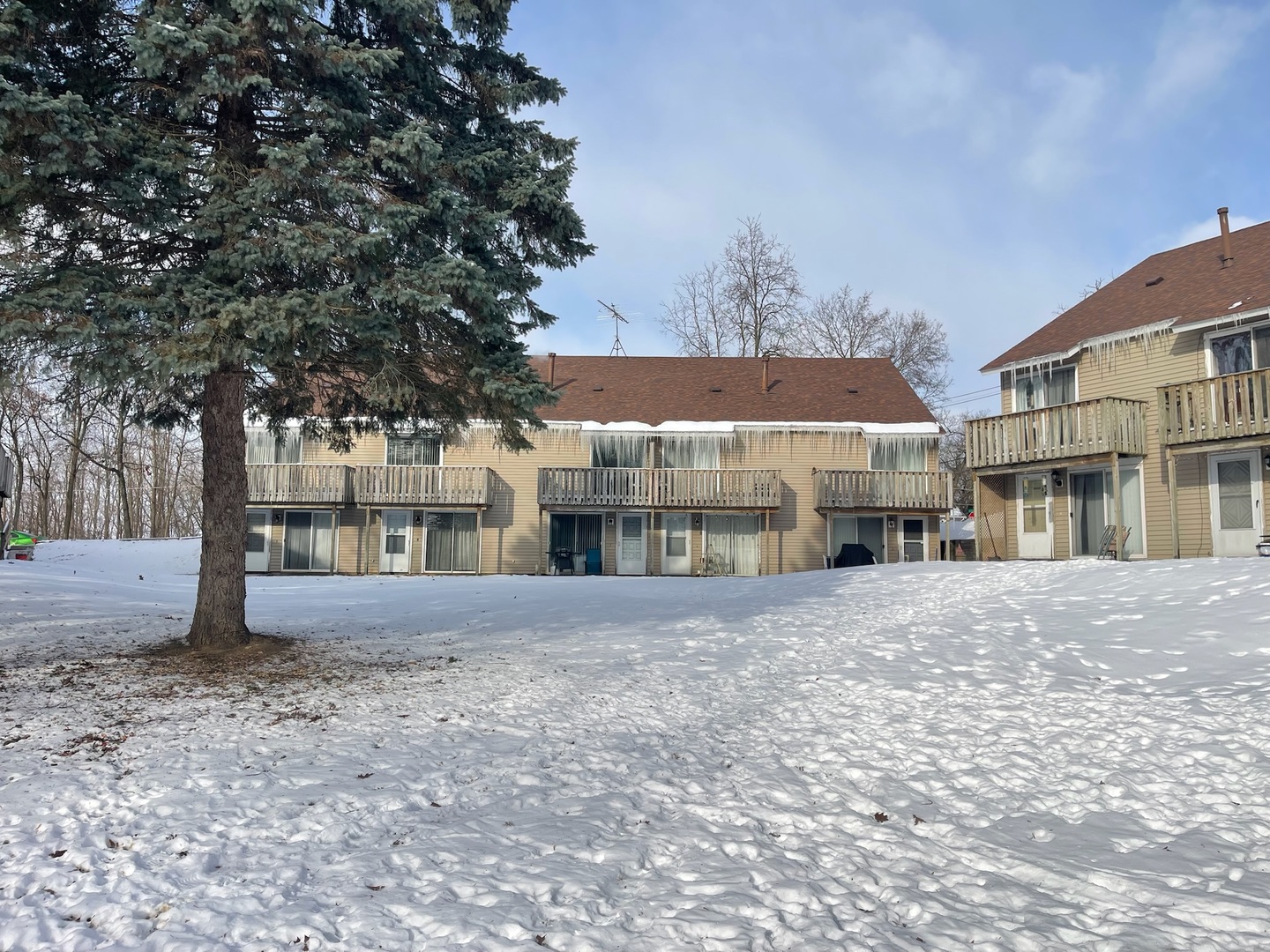 149 Forest Avenue, Unit D Fox Lake, IL 60020 - Photo 33 of 44 a view of large building with a tree in front of it