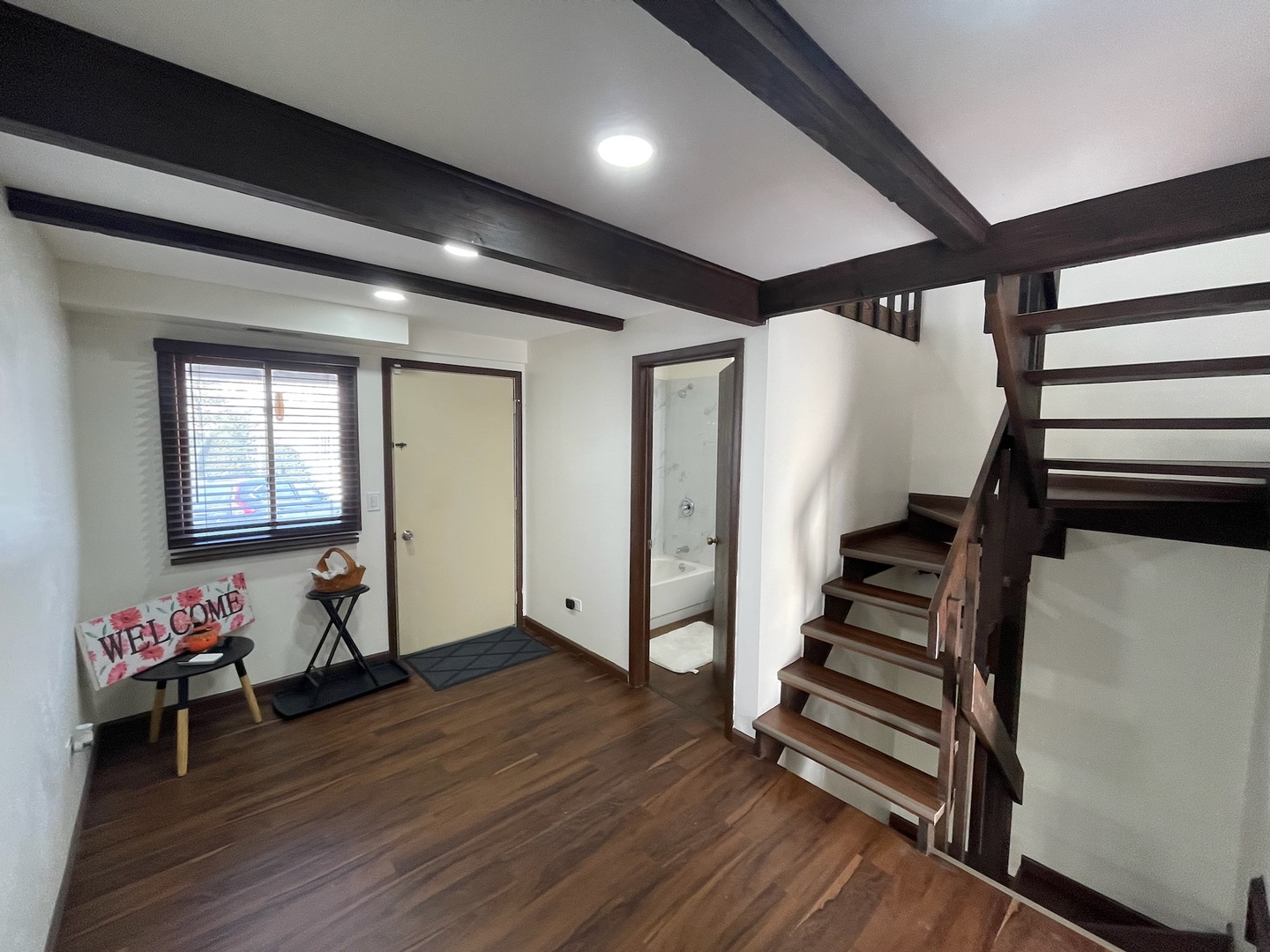149 Forest Avenue, Unit D Fox Lake, IL 60020 - Photo 5 of 44 a view of an entryway with wooden floor and stairs