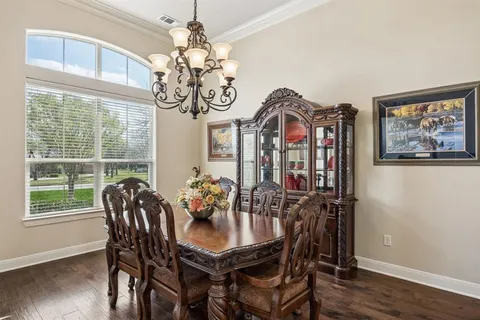 a living room with furniture ceiling fan and a rug