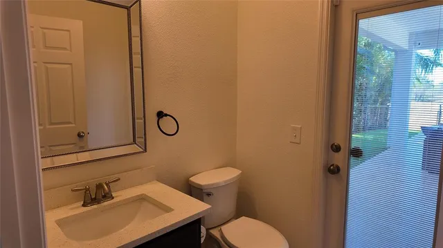 a view of a couches in the patio next to a yard