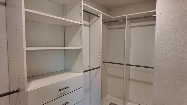 a bathroom with a double vanity sink mirror and shower