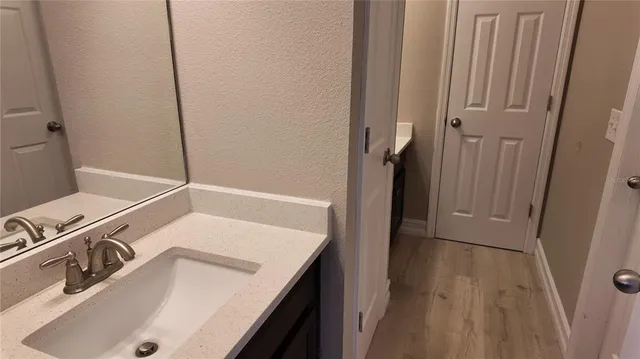 a view of a balcony with wooden floor