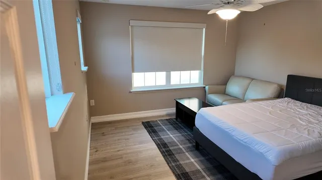 a view of balcony with furniture and potted plants