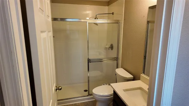 a view of a lake with wooden fence