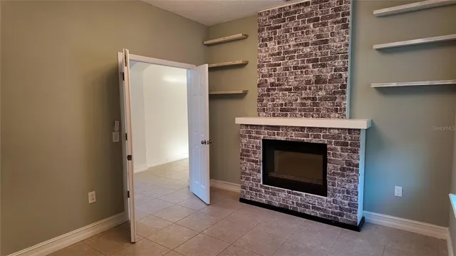 a living room with a fireplace