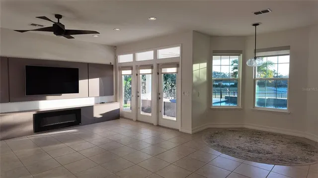a kitchen with a counter space a sink appliances and a window