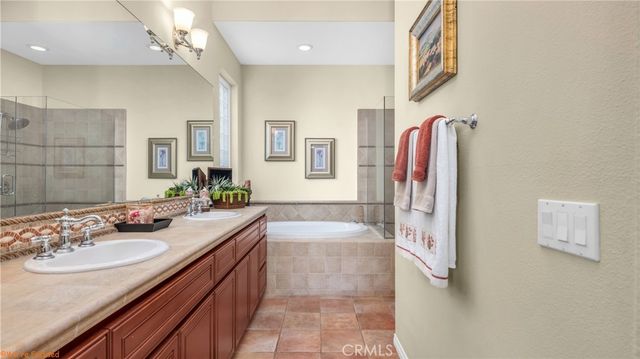 a bathroom with a sink double vanity and a mirror