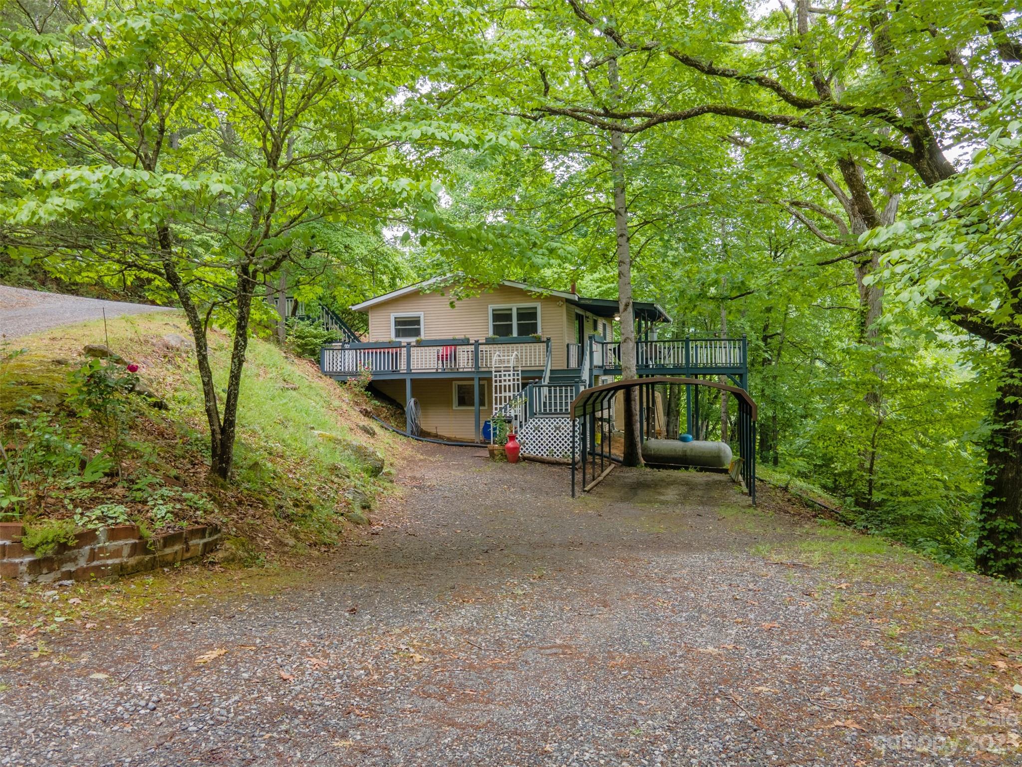 21 Turtle Rock Lane Tuckasegee, NC 28783 - Photo 20 of 32 a view of a house with a yard
