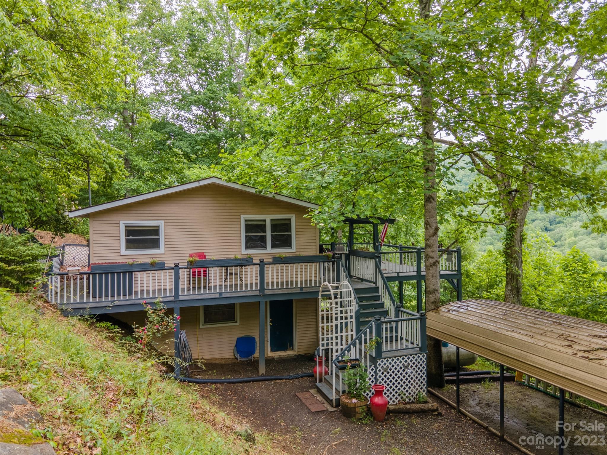 21 Turtle Rock Lane Tuckasegee, NC 28783 - Photo 21 of 32 a view of backyard with deck and outdoor seating