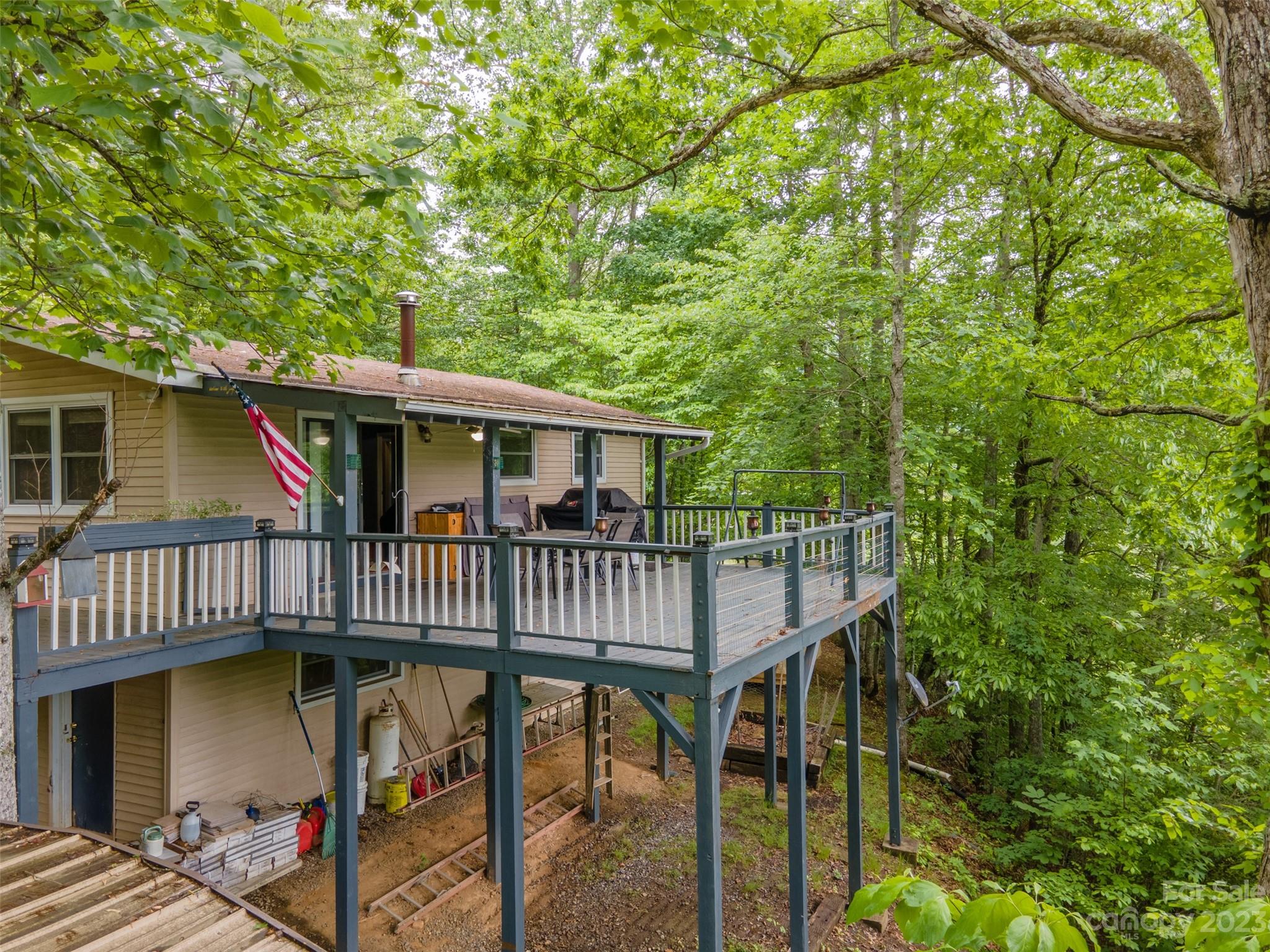 21 Turtle Rock Lane Tuckasegee, NC 28783 - Photo 24 of 32 a view of a house with a deck