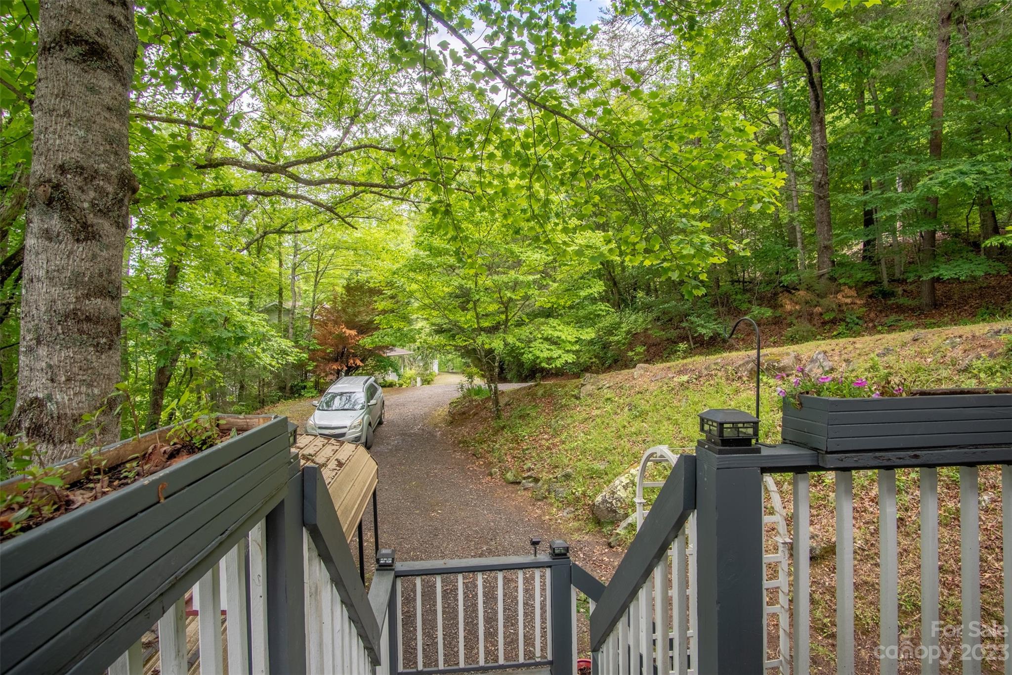 21 Turtle Rock Lane Tuckasegee, NC 28783 - Photo 25 of 32 a view of a wooden deck and a yard
