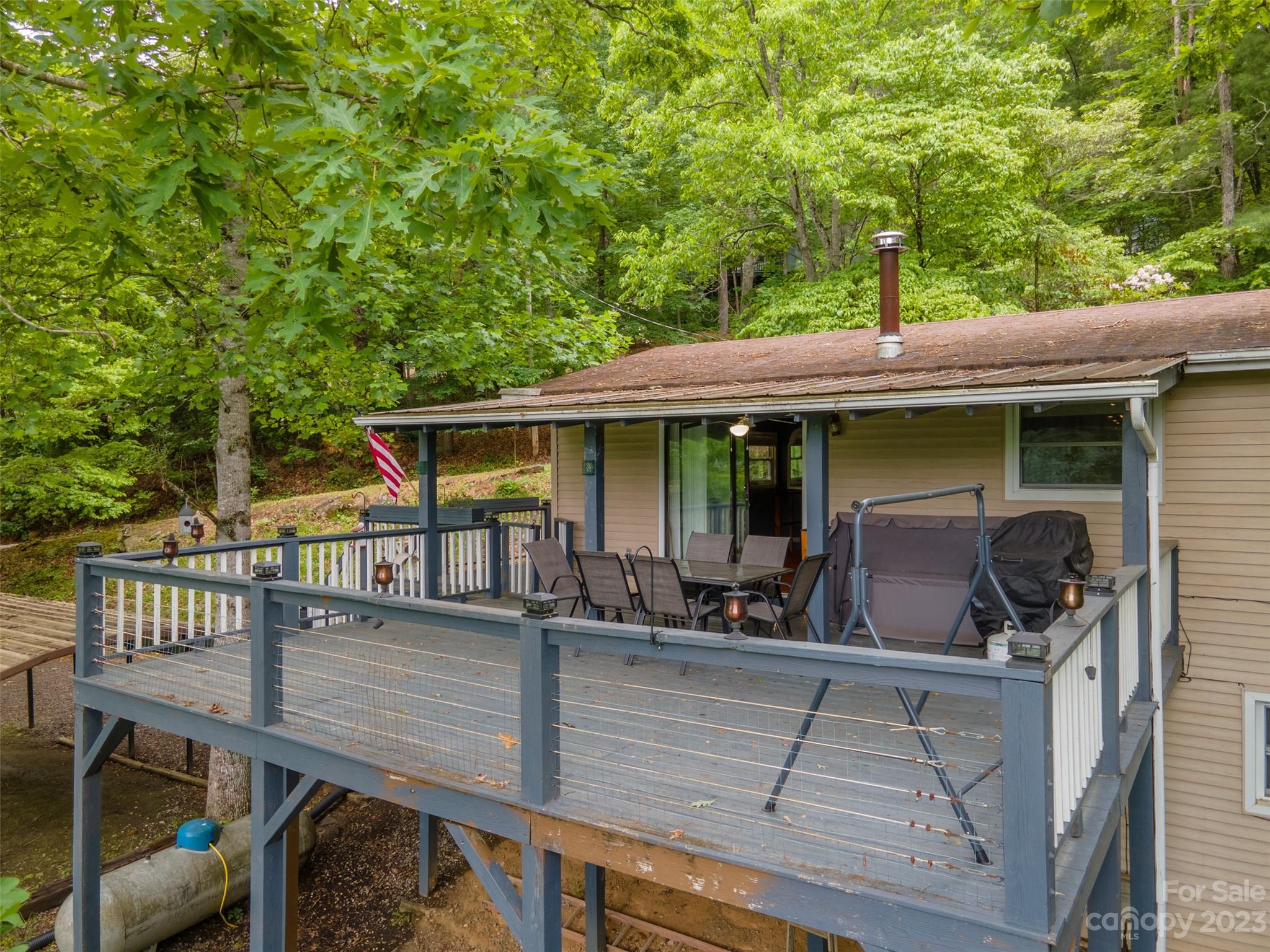 21 Turtle Rock Lane Tuckasegee, NC 28783 - Photo 28 of 32 a view of house with roof deck and furniture
