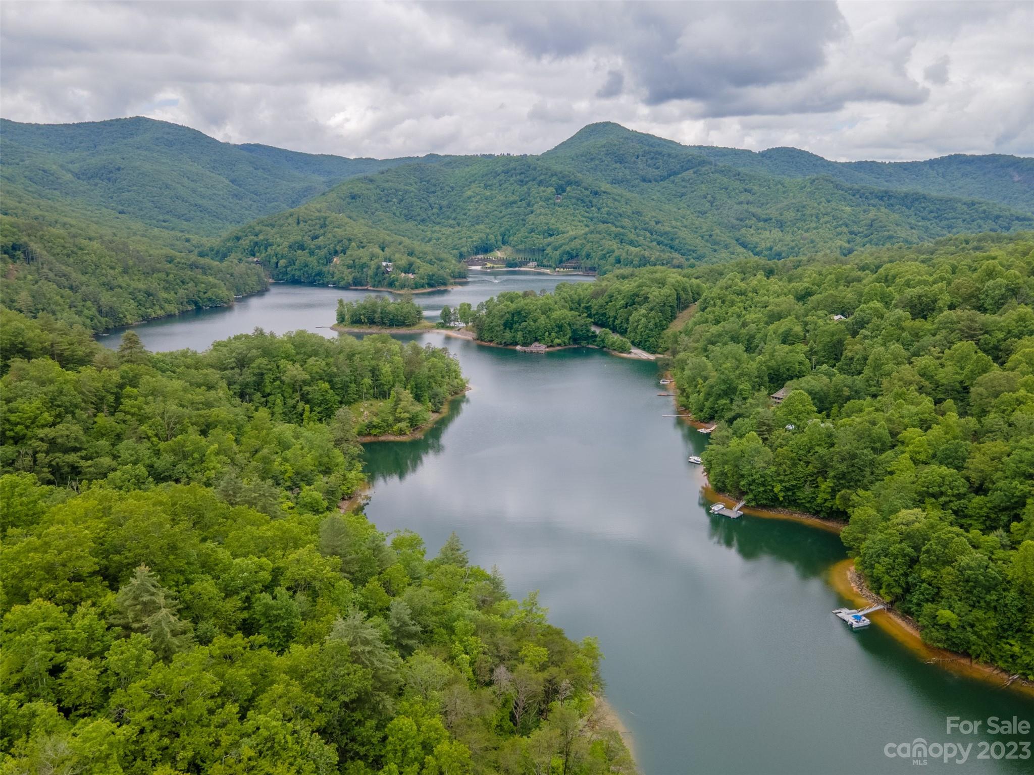 21 Turtle Rock Lane Tuckasegee, NC 28783 - Photo 31 of 32 a view of a lake with mountains in the background