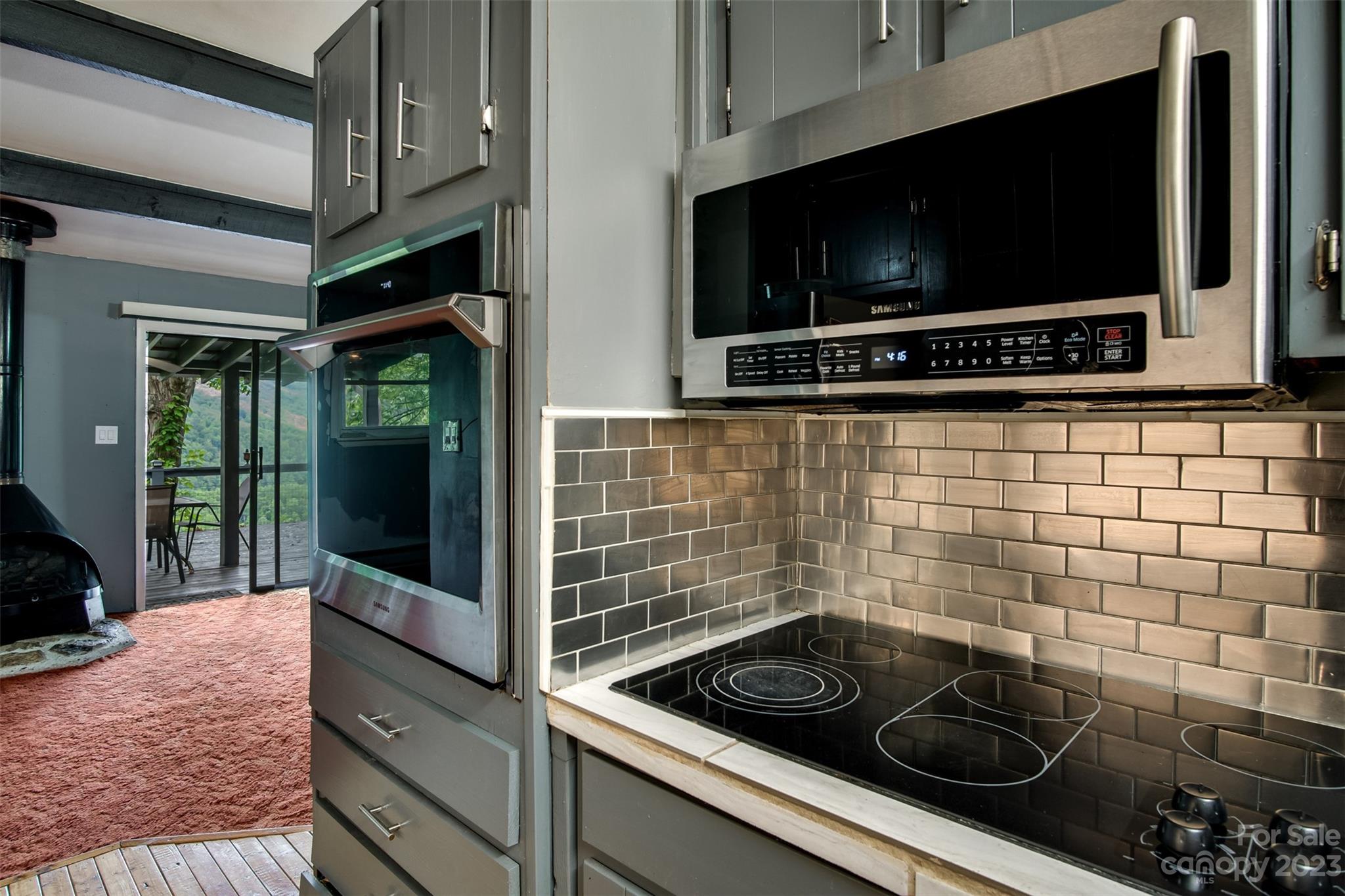 21 Turtle Rock Lane Tuckasegee, NC 28783 - Photo 5 of 32 a kitchen with a stove and a microwave