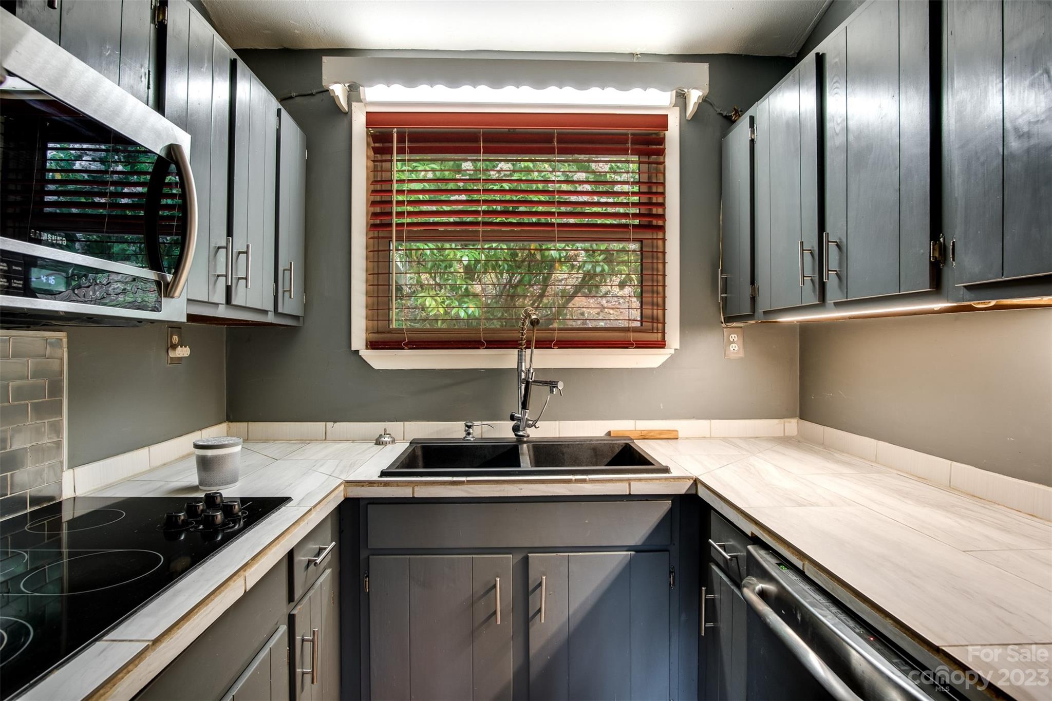 21 Turtle Rock Lane Tuckasegee, NC 28783 - Photo 6 of 32 a kitchen with a sink and a window