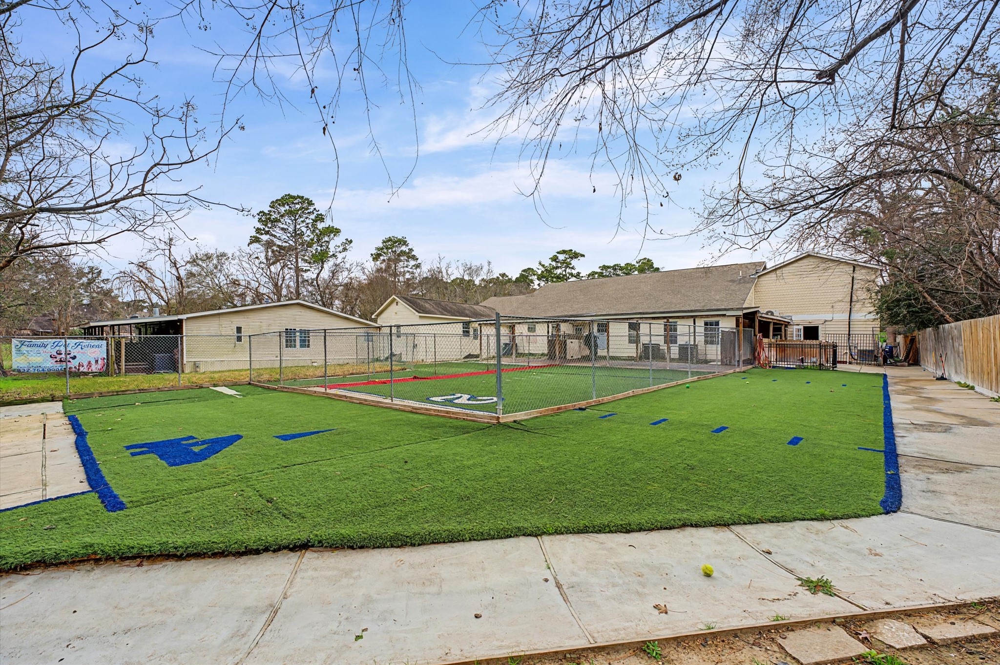 19417 Haude Road Spring, TX 77388 - Photo 13 of 29 a view of a white house with a big yard plants and large tree