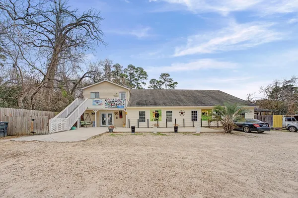 a view of house with yard and entertaining space