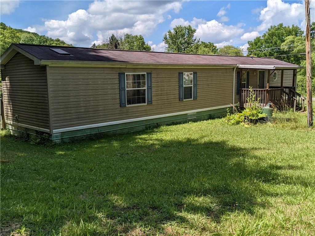 401 Keck Road Butler, PA 16002 - Photo 1 of 13 a view of a house with a backyard