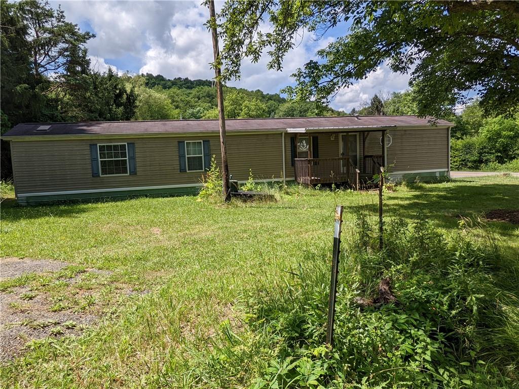 401 Keck Road Butler, PA 16002 - Photo 2 of 13 a backyard of a house with yard and barbeque oven