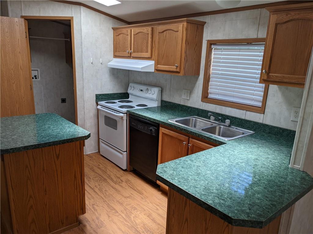 401 Keck Road Butler, PA 16002 - Photo 6 of 13 a kitchen with stainless steel appliances granite countertop a stove a sink and a microwave