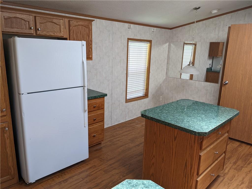401 Keck Road Butler, PA 16002 - Photo 7 of 13 a kitchen with stainless steel appliances granite countertop a refrigerator a sink a stove a microwave a counter and cabinets