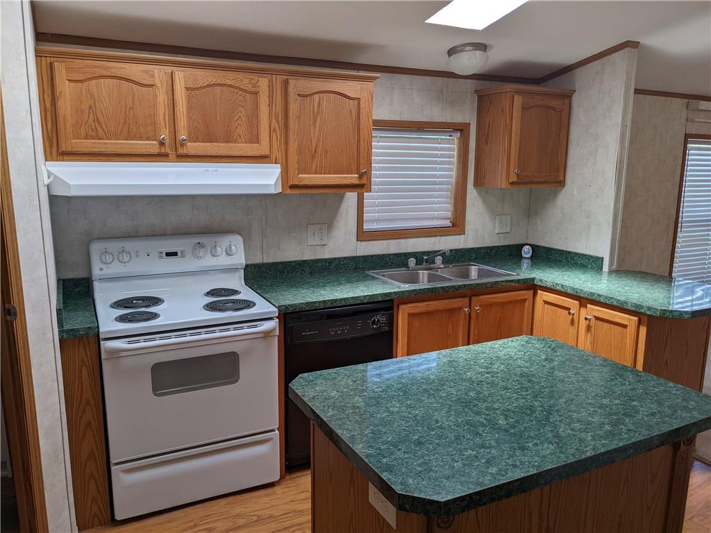 401 Keck Road Butler, PA 16002 - Photo 8 of 13 a kitchen with stainless steel appliances granite countertop a sink stove and cabinets