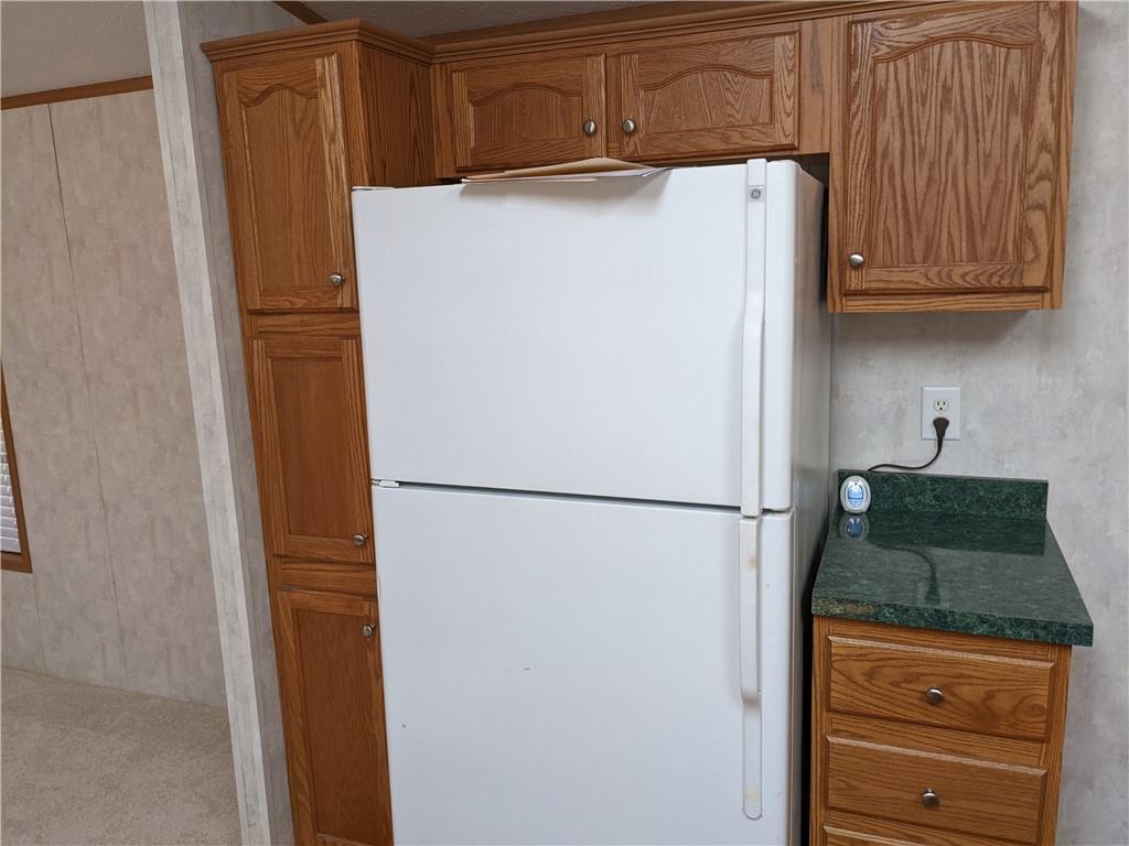 401 Keck Road Butler, PA 16002 - Photo 10 of 13 a white refrigerator freezer sitting in a kitchen