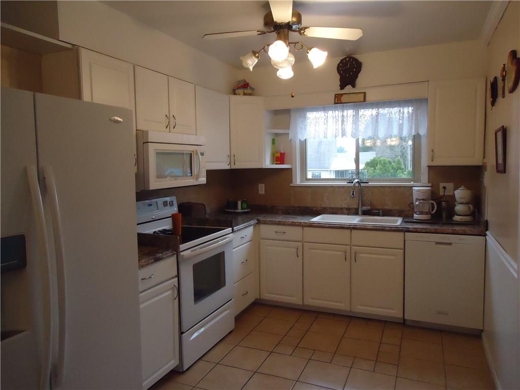 1525 Harvey Run Road Freedom, PA 15042 - Photo 4 of 24 12x9 kitchen with adjacent laundry room.