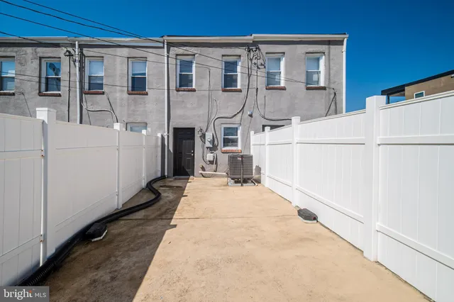 a view of a back yard of the house