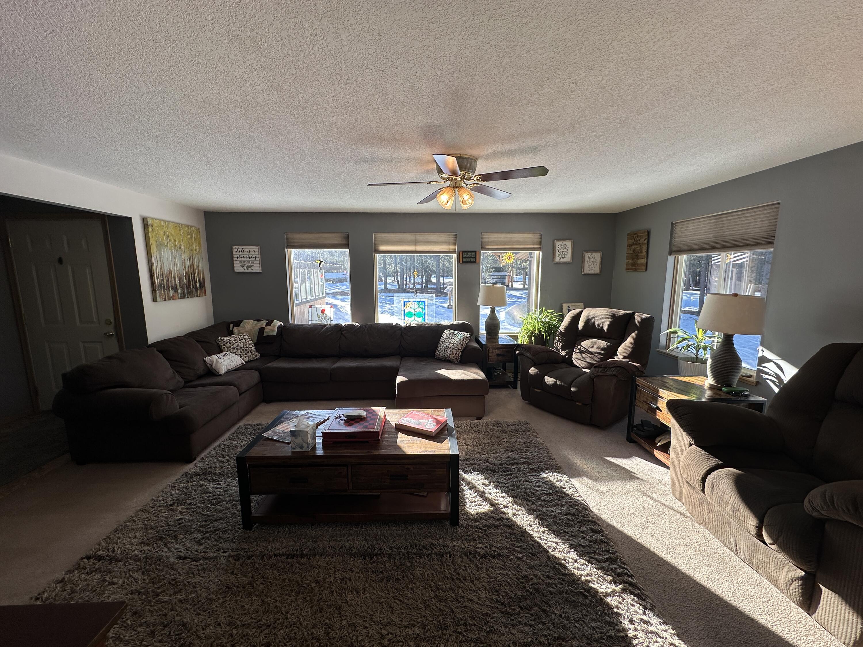 123977 Surveyor Road Crescent Lake, OR 97733 - Photo 11 of 41 a living room with furniture and a window
