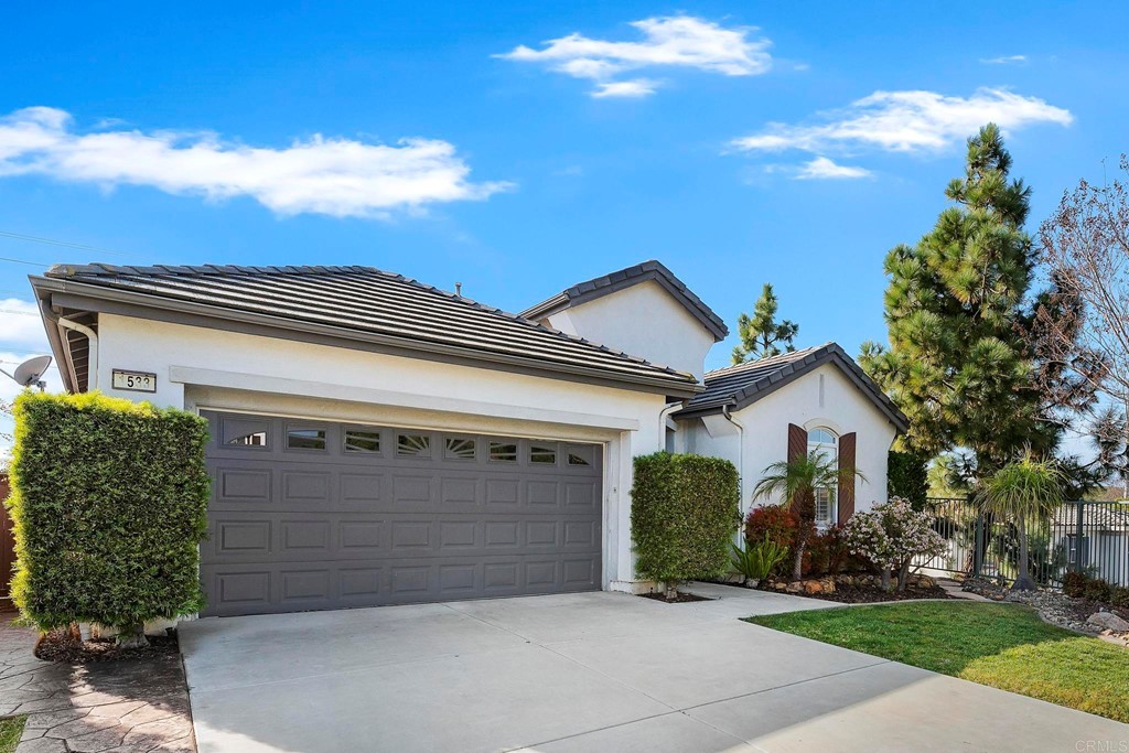 1533 Brookside Court San Marcos, CA 92078 - Photo 2 of 46 a front view of a house with a garden
