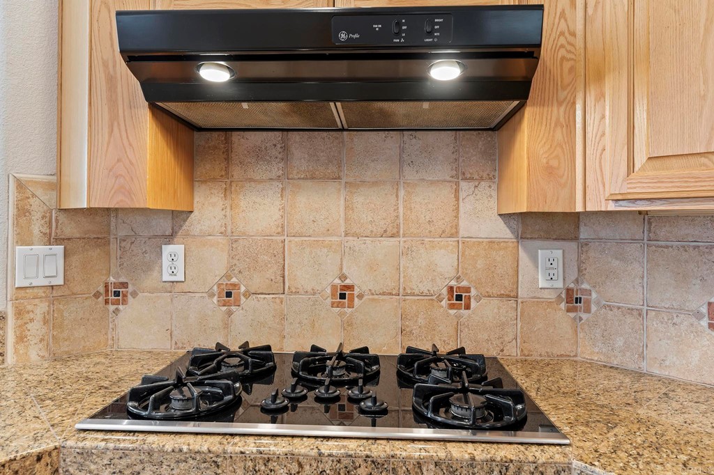 1533 Brookside Court San Marcos, CA 92078 - Photo 21 of 46 a bathroom with a stove and a shower