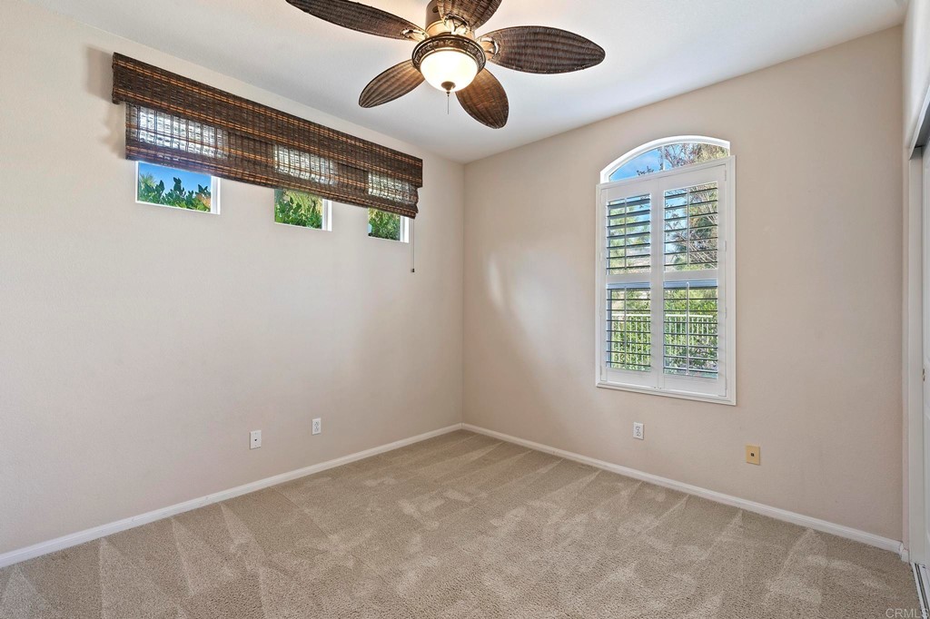 1533 Brookside Court San Marcos, CA 92078 - Photo 24 of 46 an empty room with windows and fan