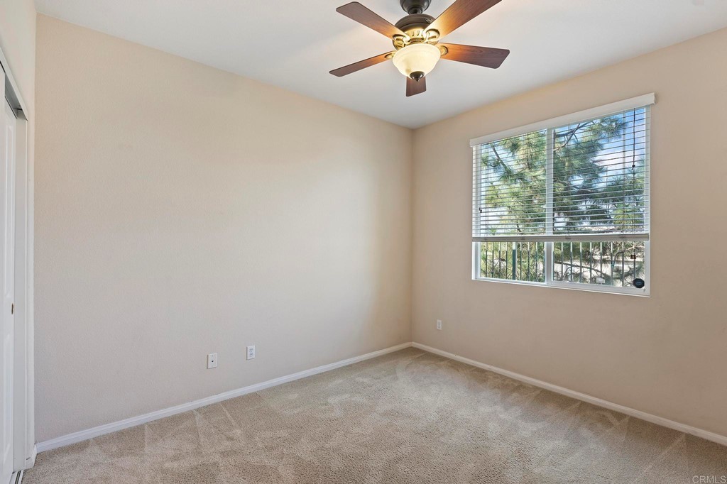 1533 Brookside Court San Marcos, CA 92078 - Photo 26 of 46 an empty room with a window and a fan