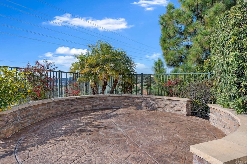 1533 Brookside Court San Marcos, CA 92078 - Photo 42 of 46 a view of a yard with plants and a bench