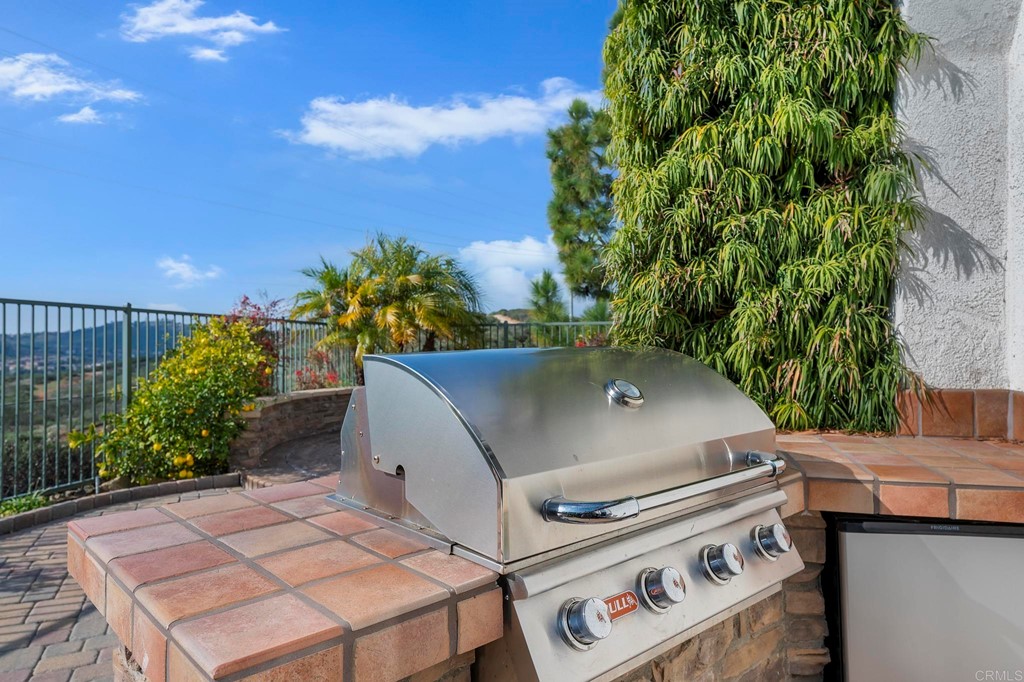1533 Brookside Court San Marcos, CA 92078 - Photo 44 of 46 a view of a patio with table and chairs and potted plants
