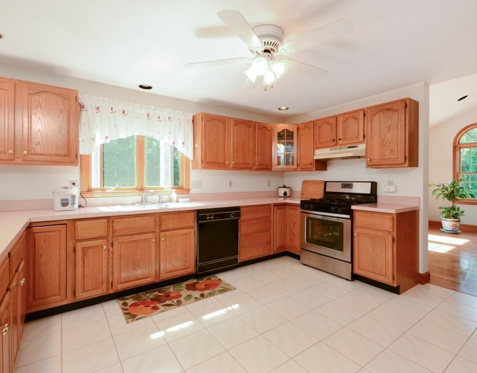 726 Depot Road Boxborough, MA 01719 - Photo 11 of 36 a kitchen with granite countertop a sink cabinets and stainless steel appliances