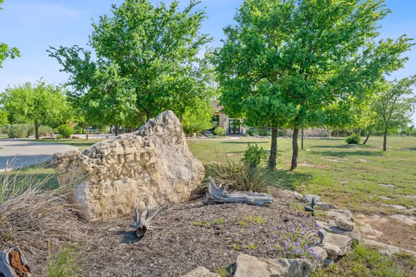 a kitchen with stainless steel appliances granite countertop a sink and a stove