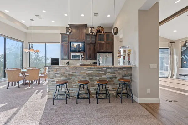 a bathroom with double sink and a mirror