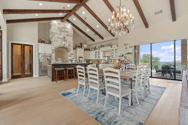 a living room with furniture fireplace and a large window