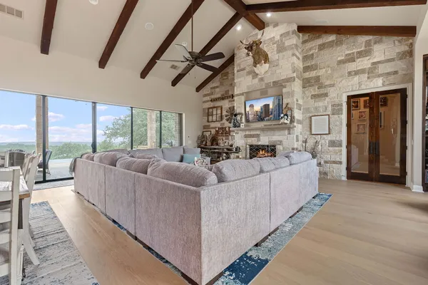 a living room with furniture and a large window