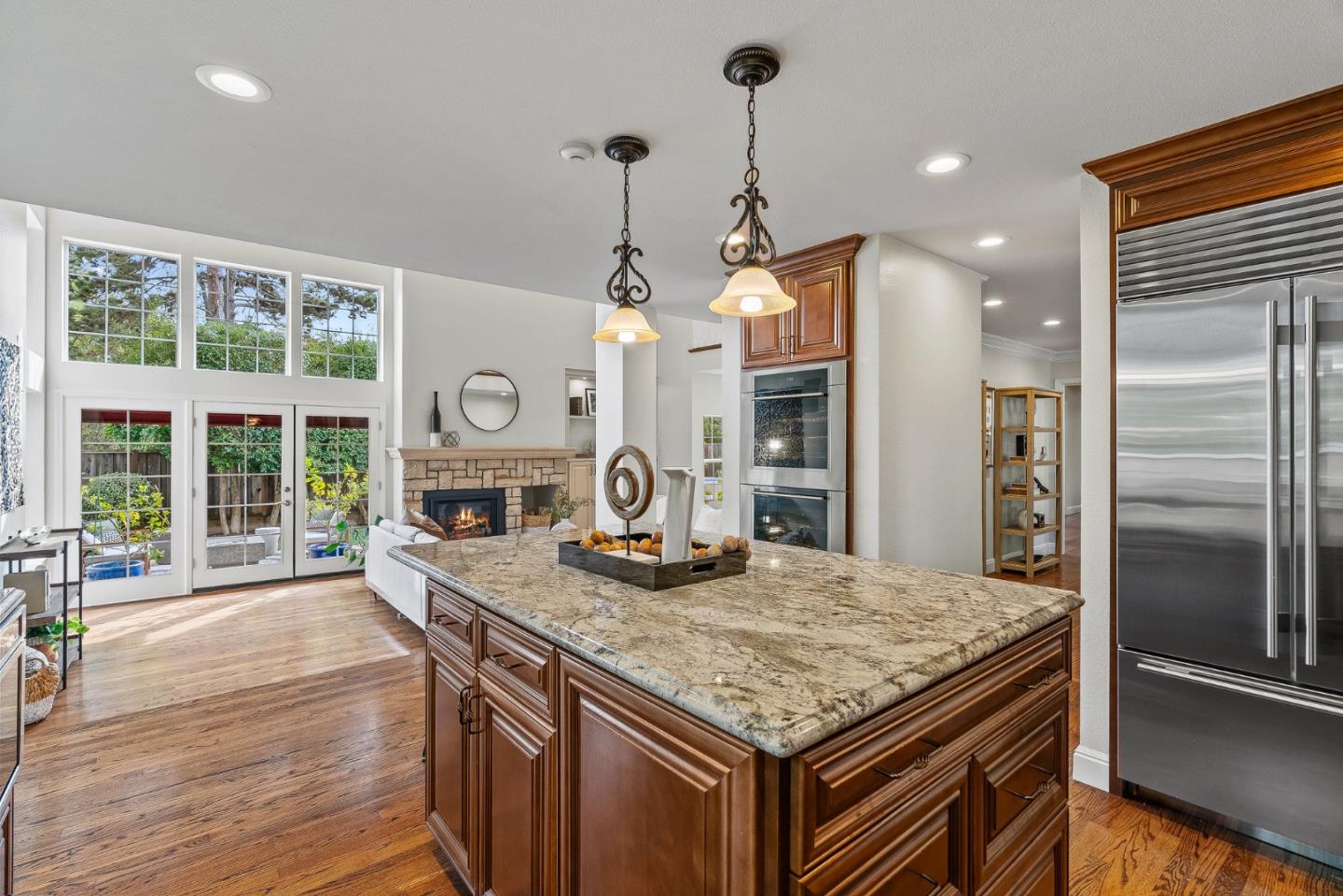 15650 Michael Lane Monte Sereno, CA 95030 - Photo 19 of 54 a kitchen with granite countertop kitchen island stainless steel appliances a sink stove and refrigerator
