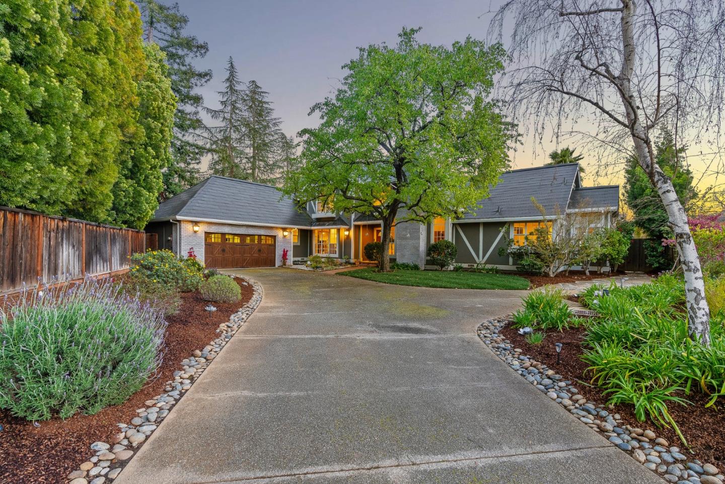 15650 Michael Lane Monte Sereno, CA 95030 - Photo 2 of 54 a front view of a house with a yard and a garage